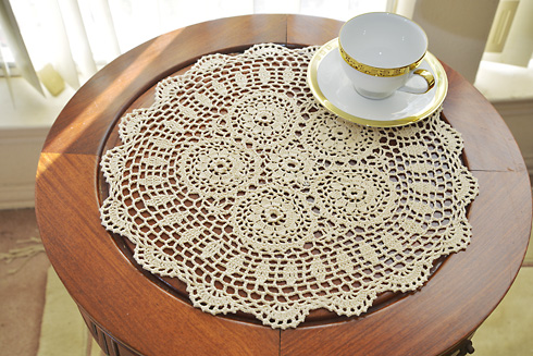 crochet round doily. 16" round. wheat color. 2 pieces